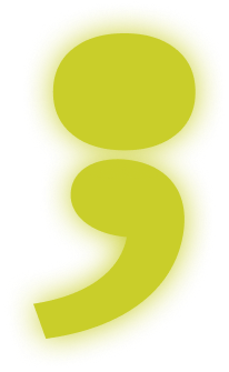 A large, yellow-green comma shape with a soft, blurred edge on a transparent background.