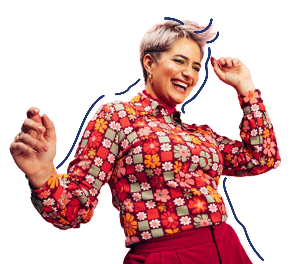 A smiling person with short, light-colored hair dances joyfully, wearing a colorful, flower-patterned shirt and red pants against a transparent background.